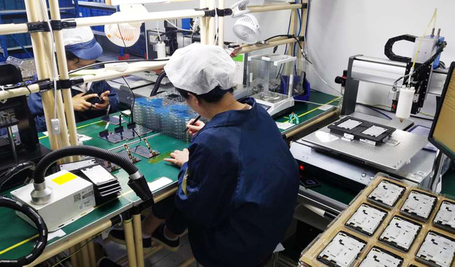 Barway Barcode production workshop with workers assembling RFID devices.